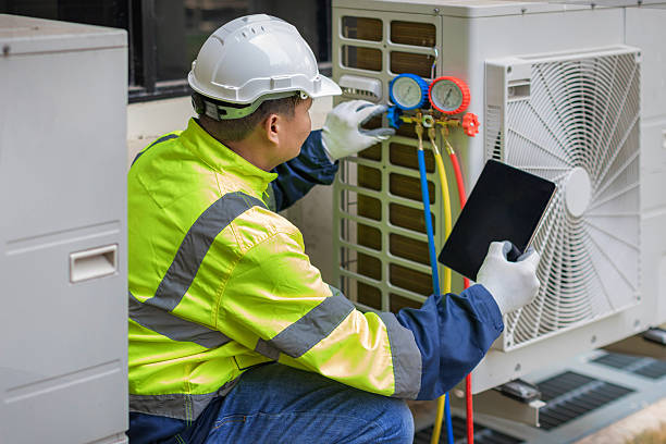 Professional Heat Pump Repair technician working in Simonton, TX